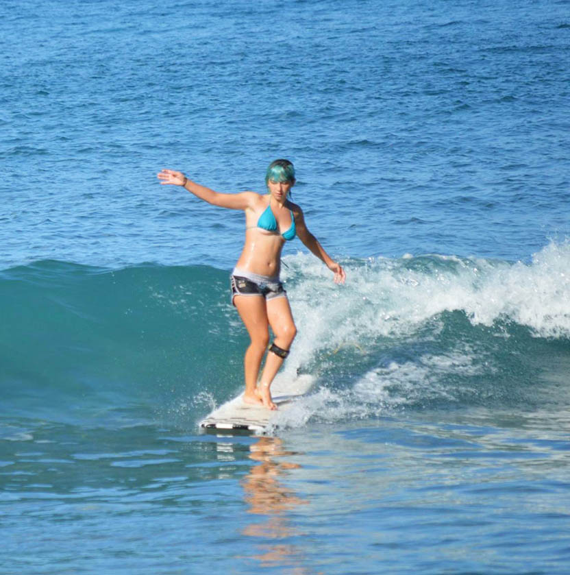 woman taking surf lessons maui hawaii